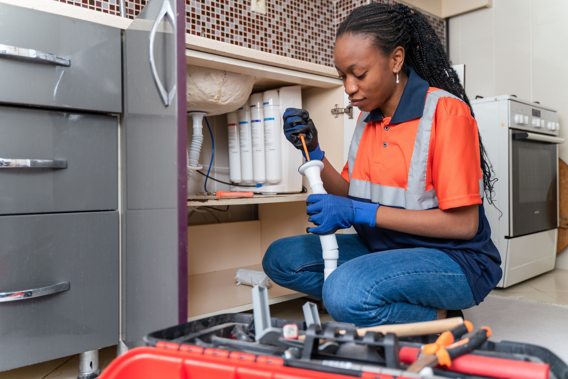 Black female plumber at work